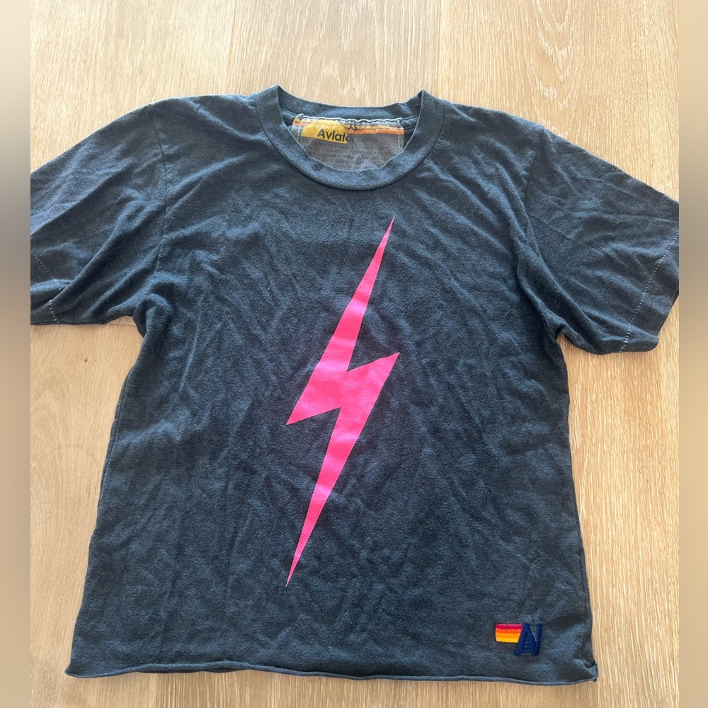 Women’s size XS Aviator Nation black shirt with pink lighting bolt. No defects.